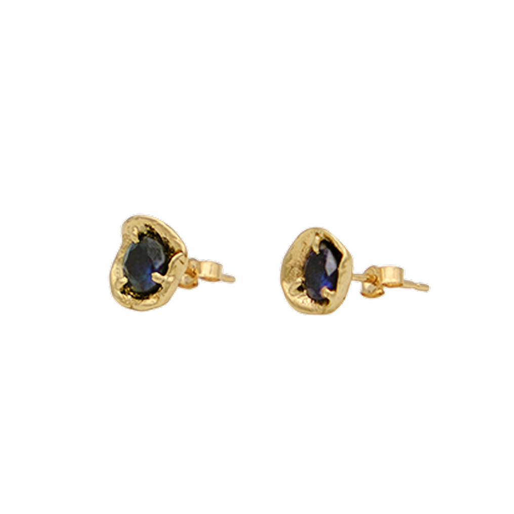 Gold earrings with blue gemstones on a white background