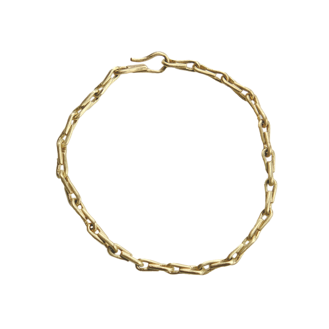 Gold chain bracelet on a white background