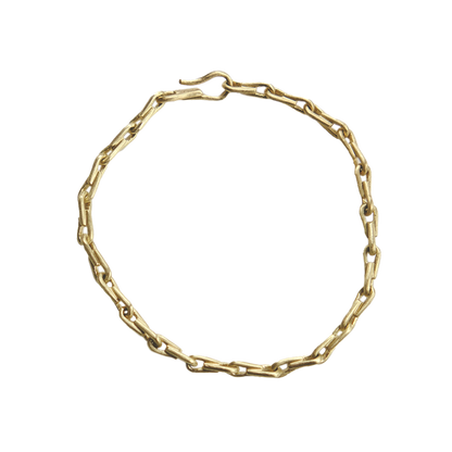 Gold chain bracelet on a white background