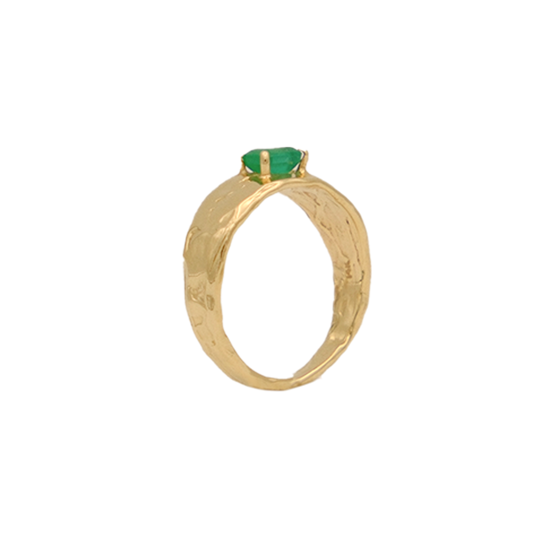 Organic gold ring with a green gemstone on a white background