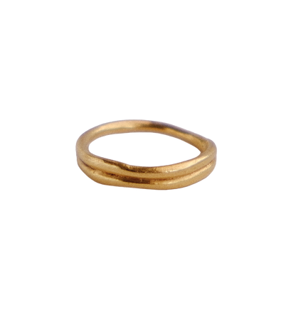 Organic double band gold ring against white background.